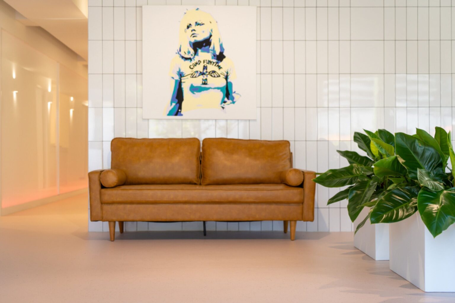 Planting in a white trough beside a tan leather sofa in the Teneriffe Dental waiting room